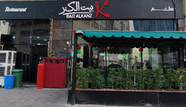 traditional Syrian chef preparing authentic Middle Eastern dishes in modern kitchen with fresh ingredients